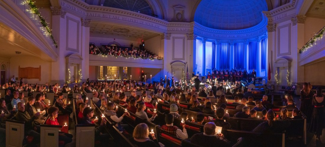 Audience in Hendricks Chapel holds flickering candles