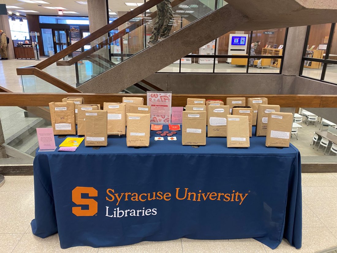 table with wrapped books to pick