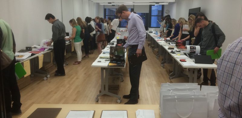 Prospective employers review communication design students work in NYC.