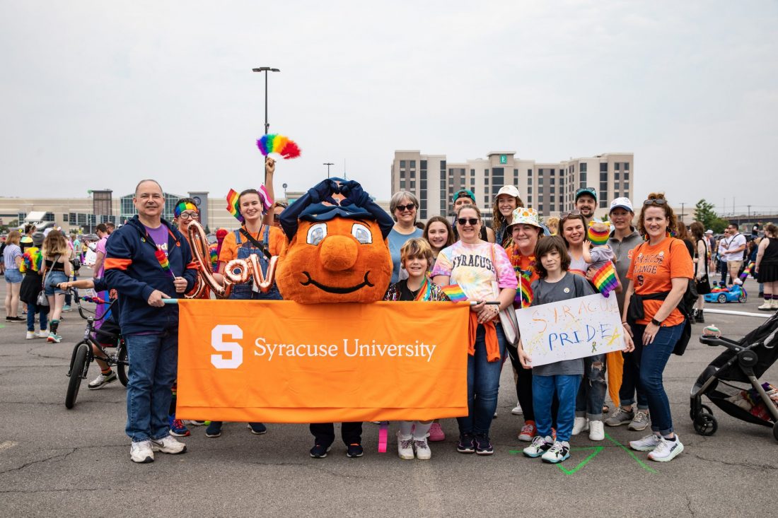 Members of the Syracuse University community and Otto the Orange marching in the CNY Pride parade on June 10, 2023. (Photo by Randy Pellis)