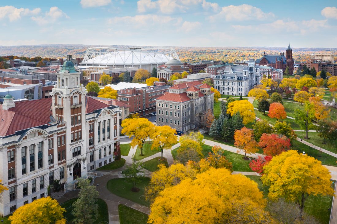 Walking paths crisscross through campus in front of Lyman and Smith Halls with the Hall of Languages and Crouse College in the distance.