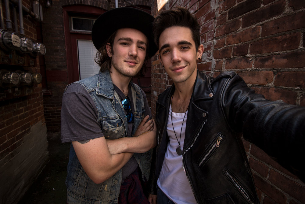 Ende Brothers pose together in an alleyway