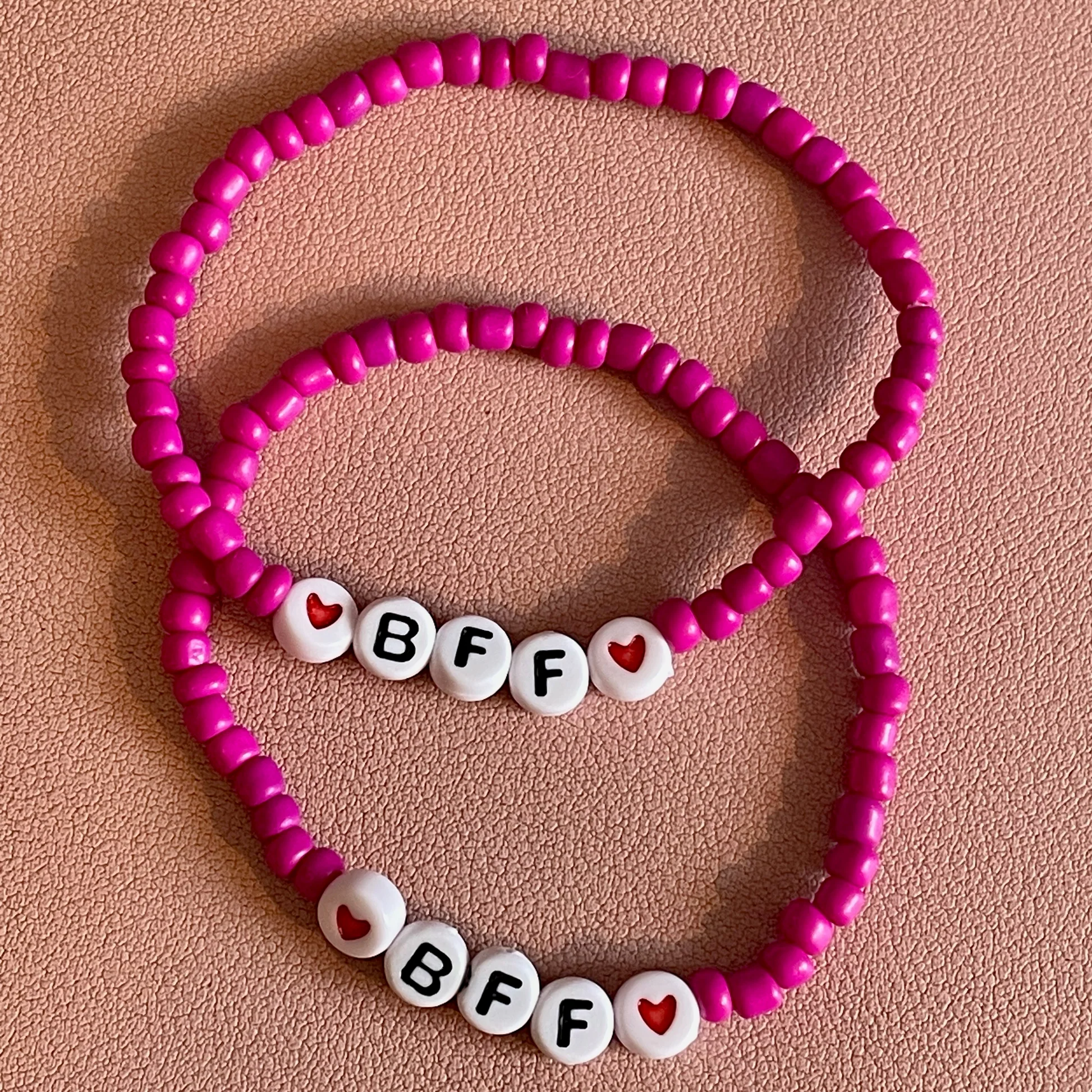 pink beaded bracelets with a heart bead and BFF spelled out