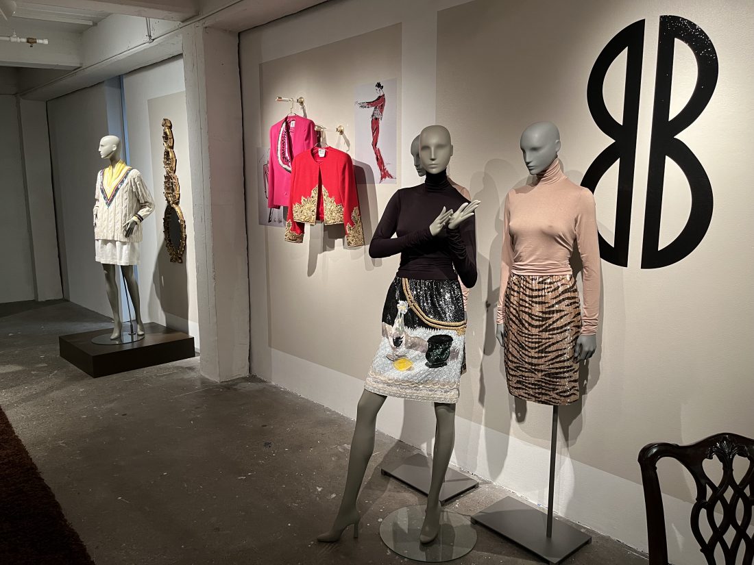 Mannequins in a gallery wearing skirts and tops