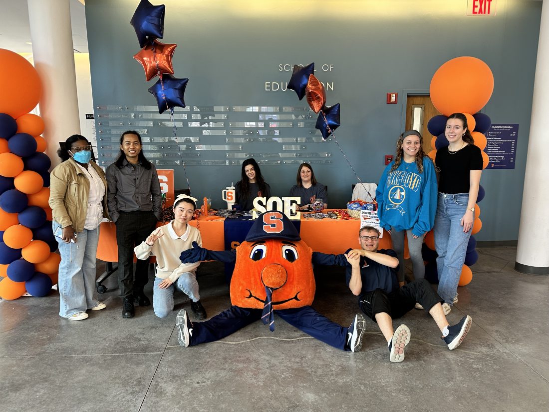 Students and Otto in the Jacquet Education Commons at the School of Education