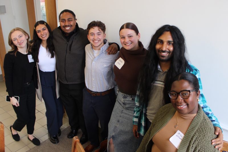 higher education master's students smile at the camera