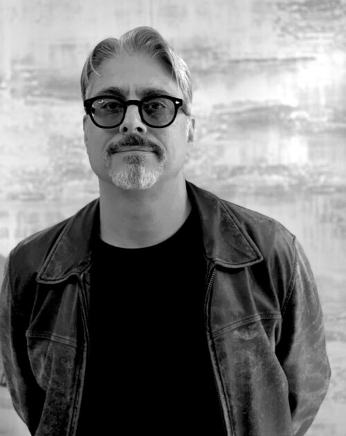 black and white portrait of a male wearing sunglasses 