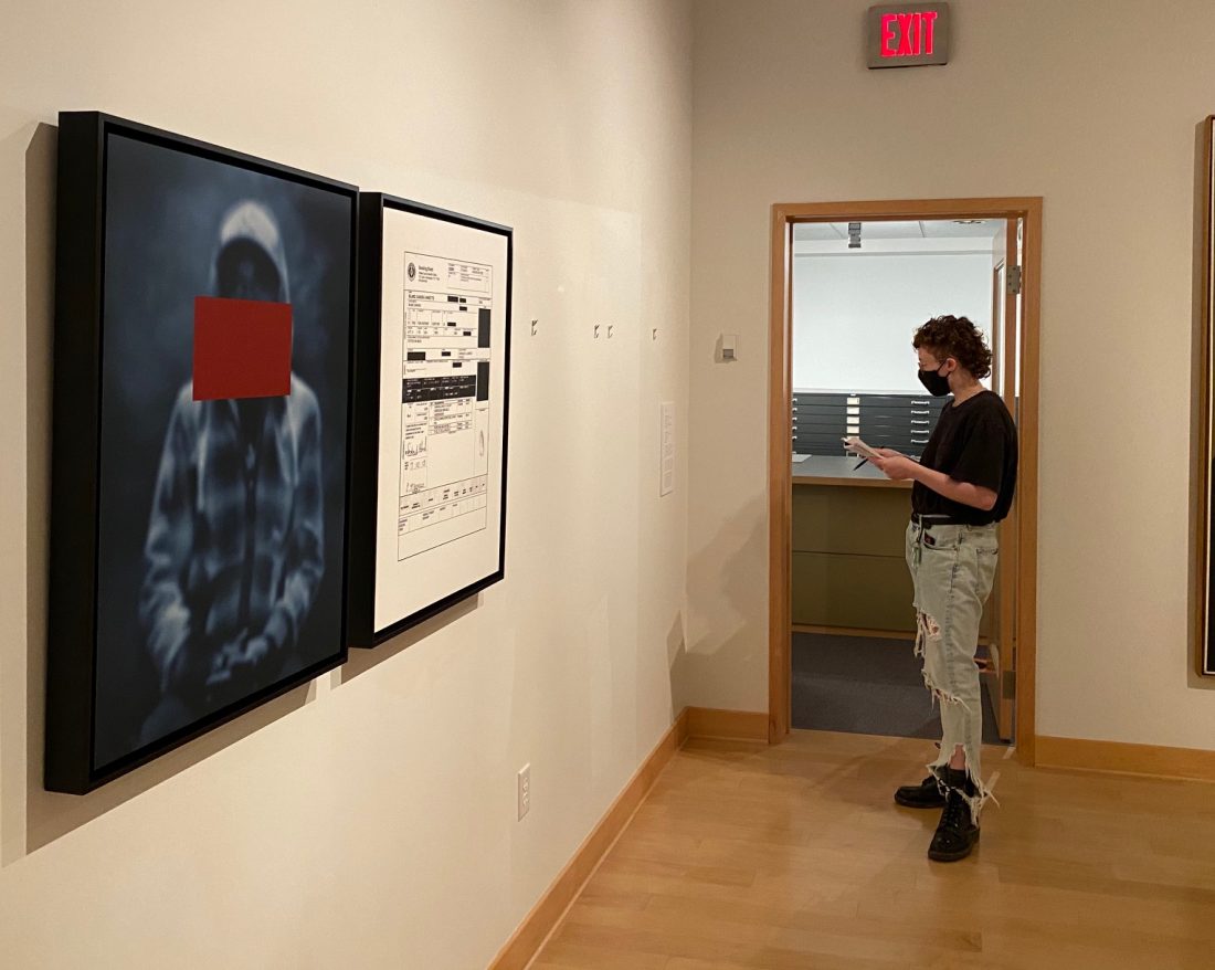 Woman in a museum looking at artwork