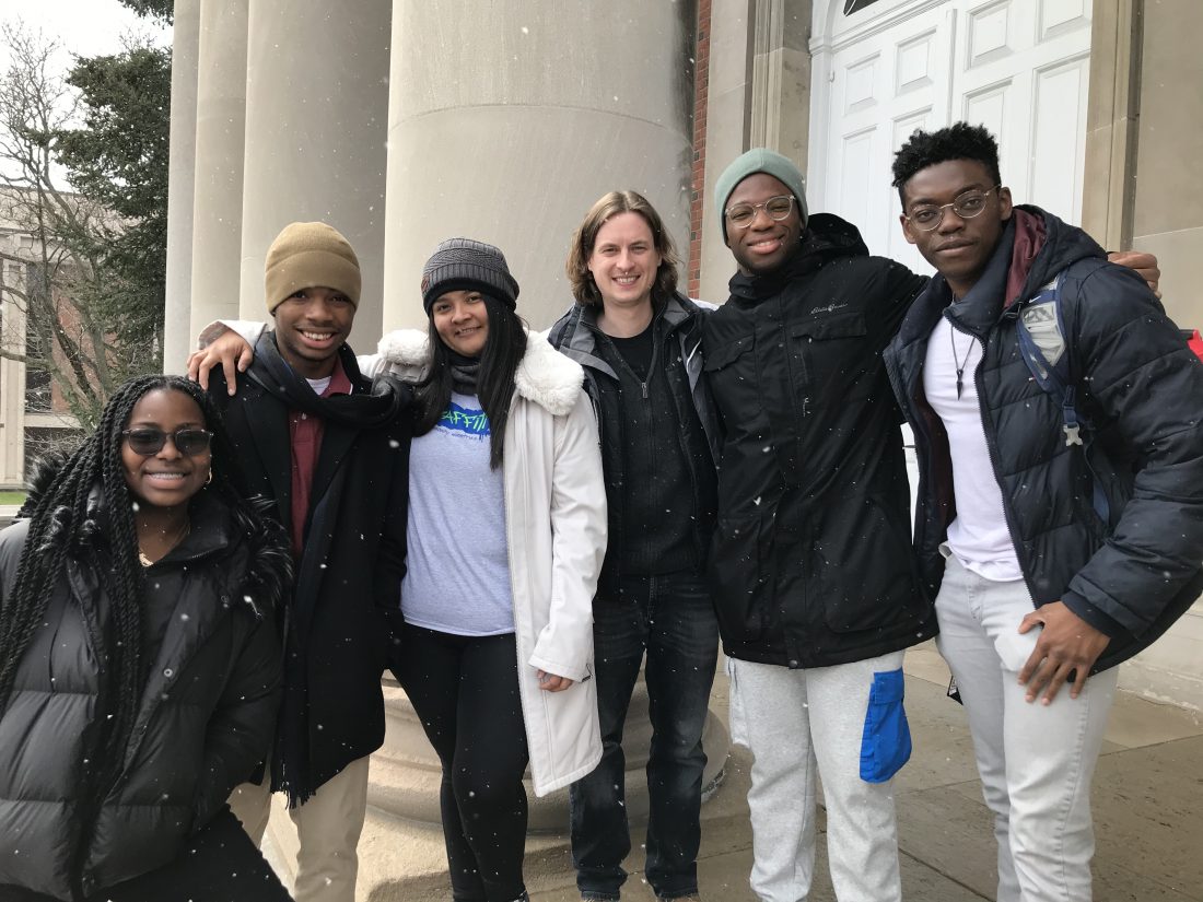 Group of students standing in the snow.