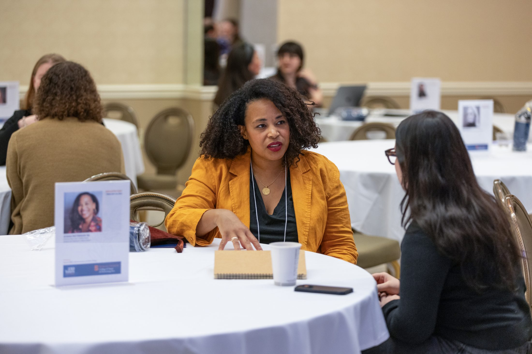 An individual talks with a student.