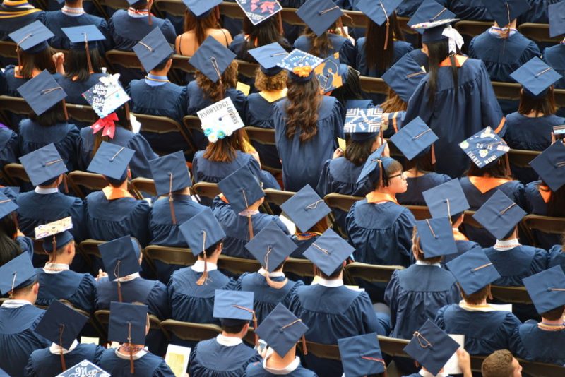 graduation caps in a crowd
