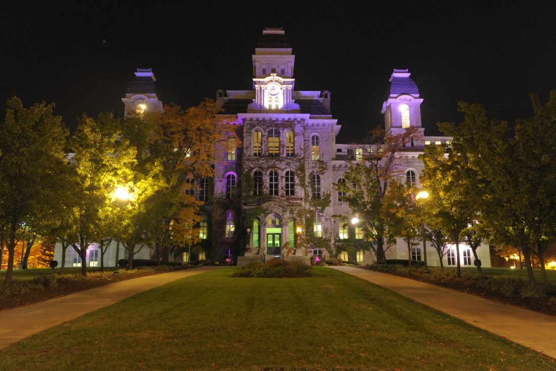 The Hall of Languages illuminated in purple for Domestic and Dating Violence Awareness Month.