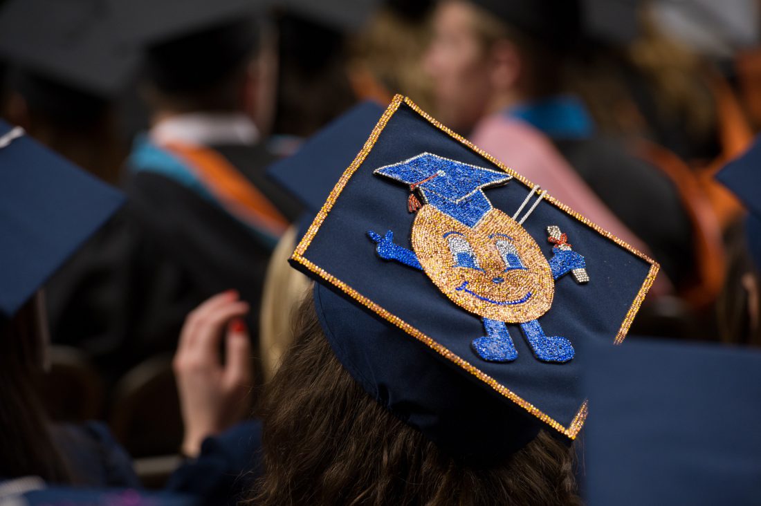 A mortarboard with Otto the Orange