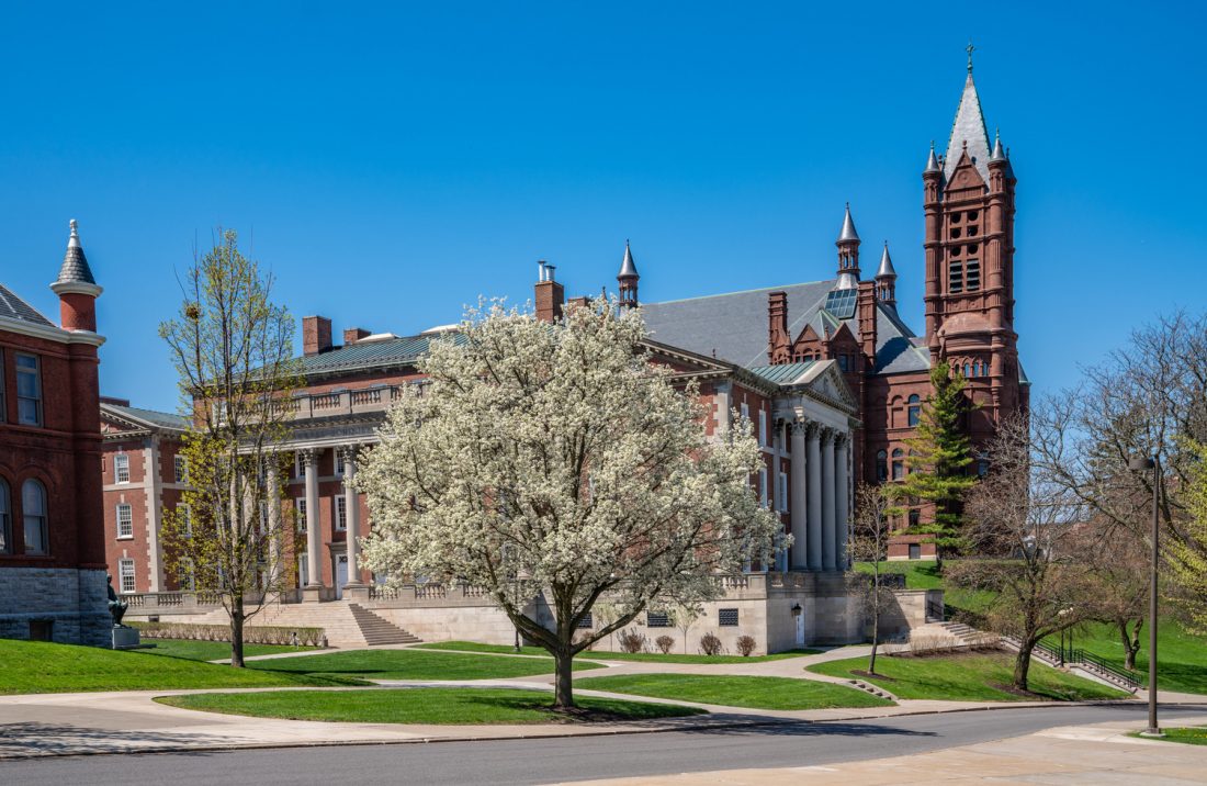 Spring trees in front of Crouse College, Tolley and Maxwell.