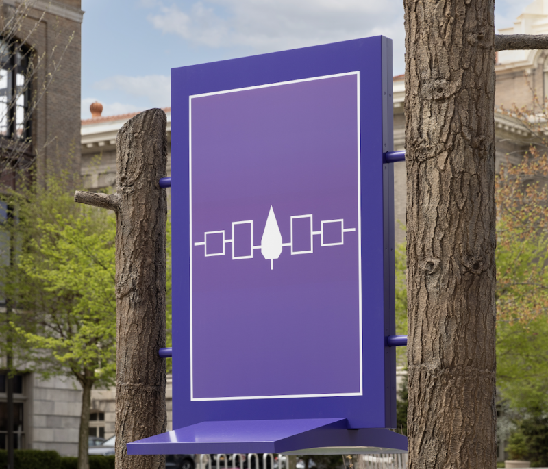 A “placeholder” of the purple Haudenosaunee flag is shown where the art will be placed. 