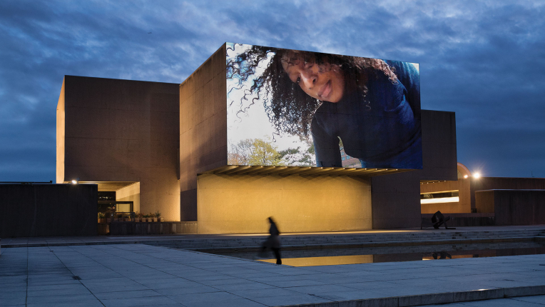 A building with a video projected on it