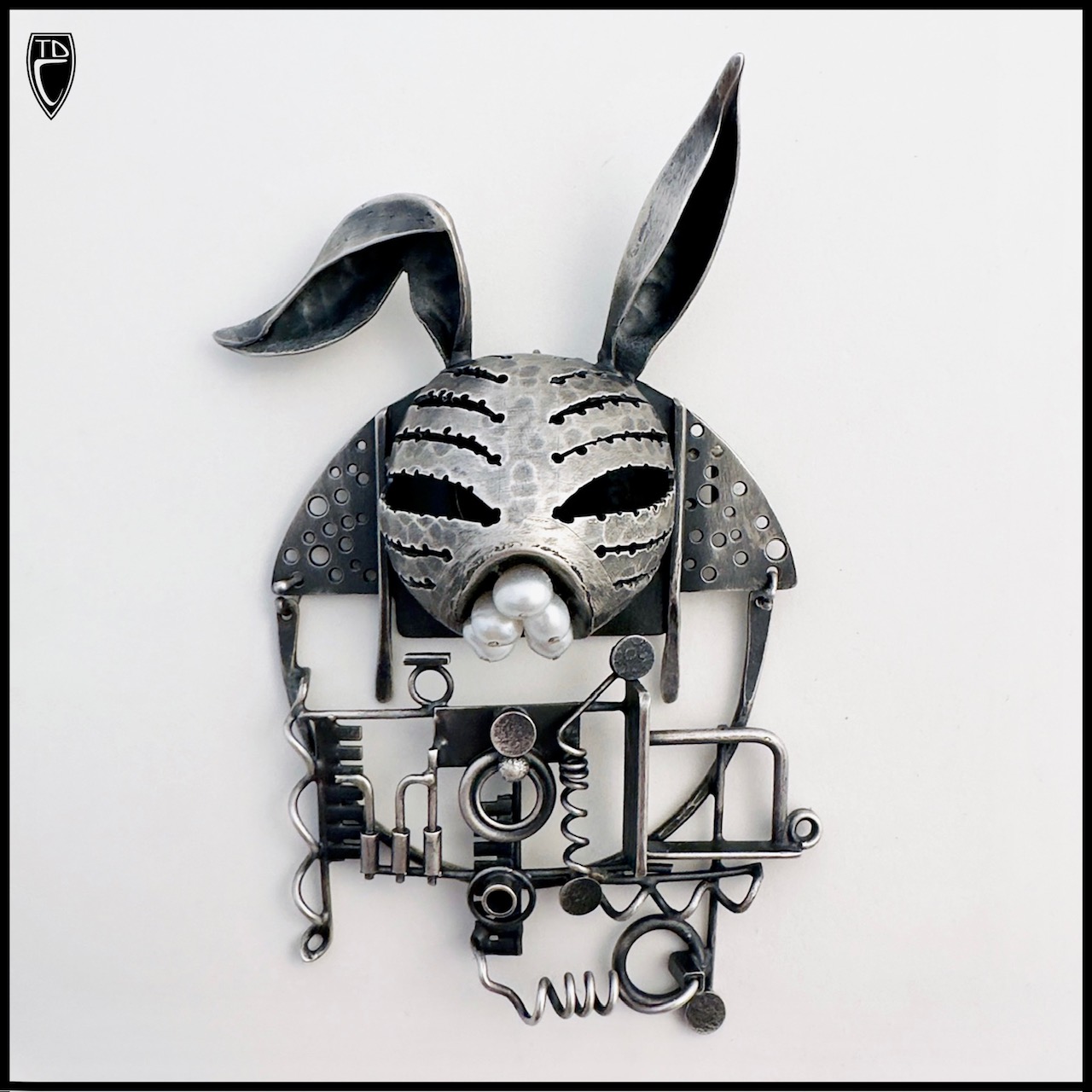 Todd Conover, “Robo Bunny”; sterling silver, pearl and steel.