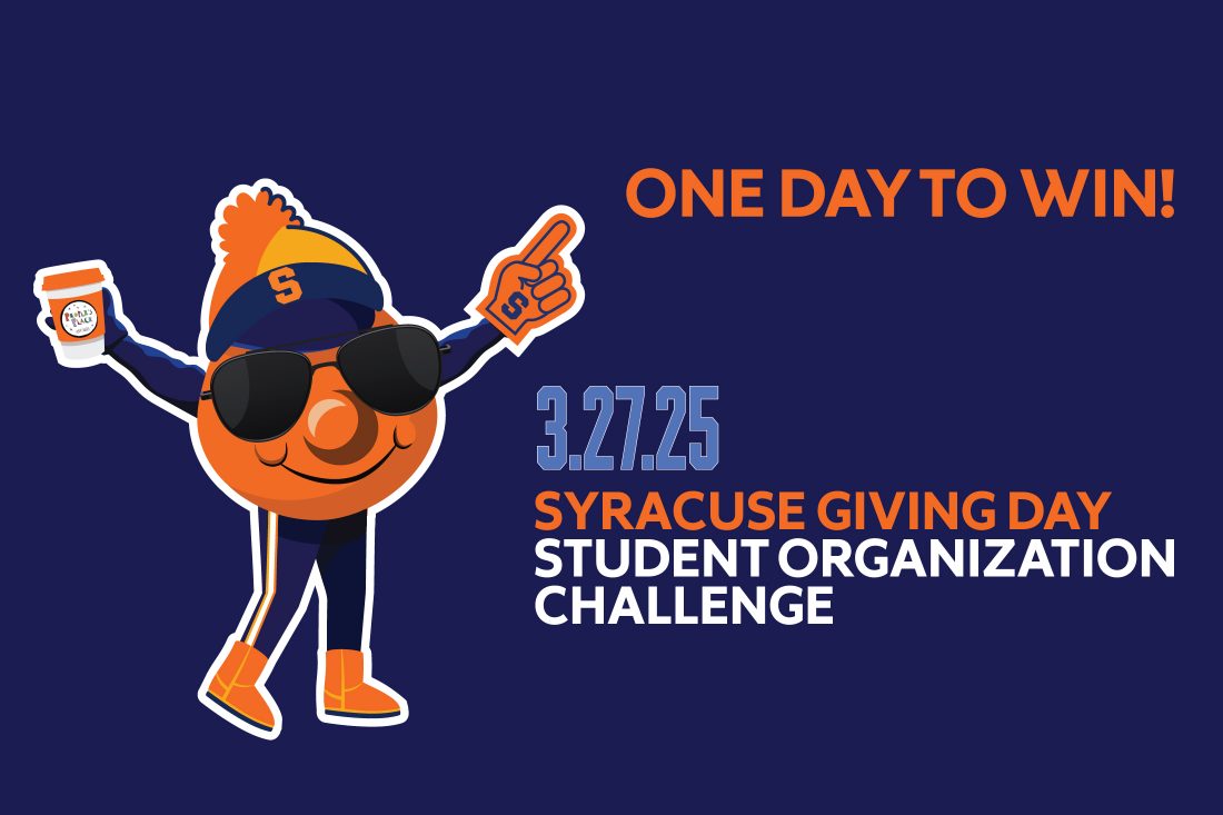 Otto points to the words 'One Day to Win'. Promoting the Syracuse University Giving Day Student Organization Challenge on March 27.