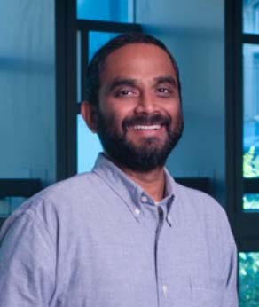 A headshot of Dr. Vivek Shinoy, smiling