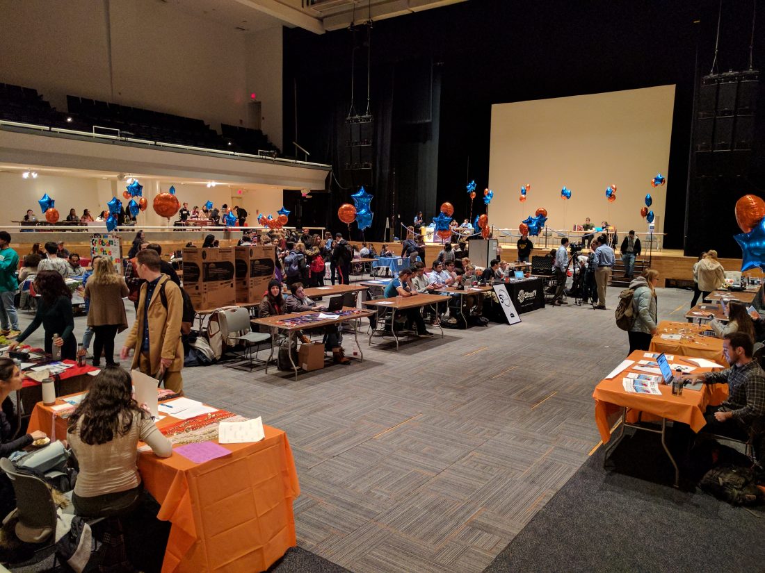 Various tables set up with displays from different student organizations