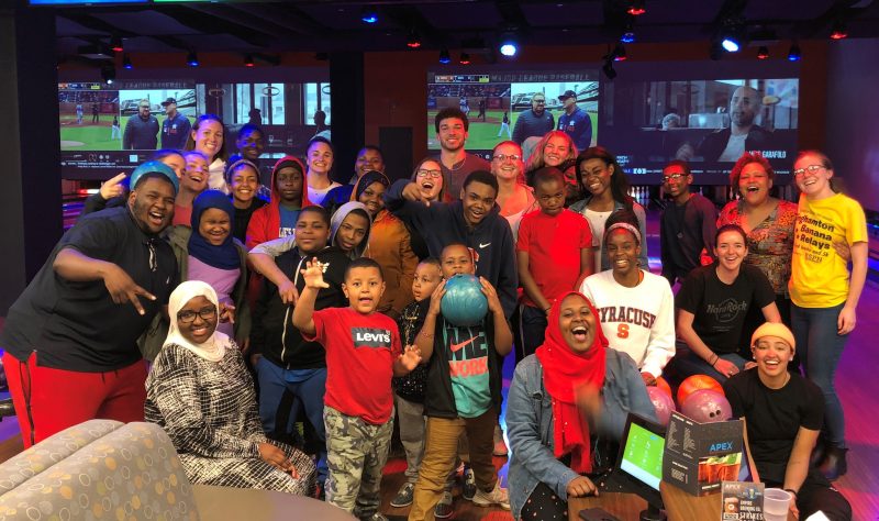 Syracuse University students and local youth at Apex Entertainment