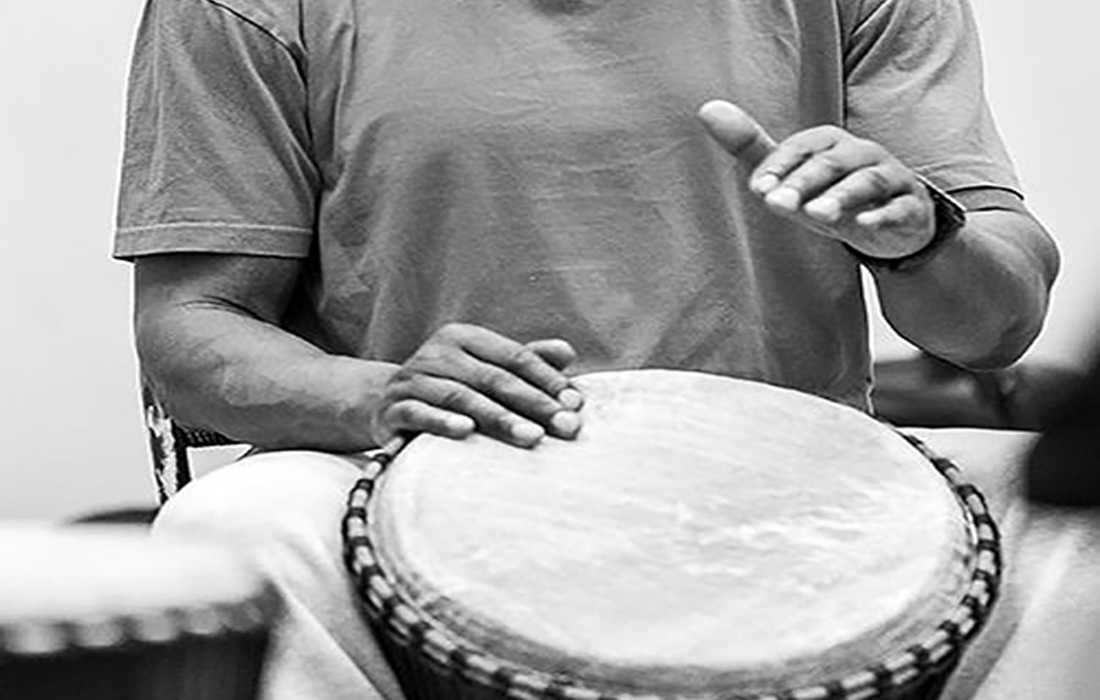 Hands drumming on a hand drum