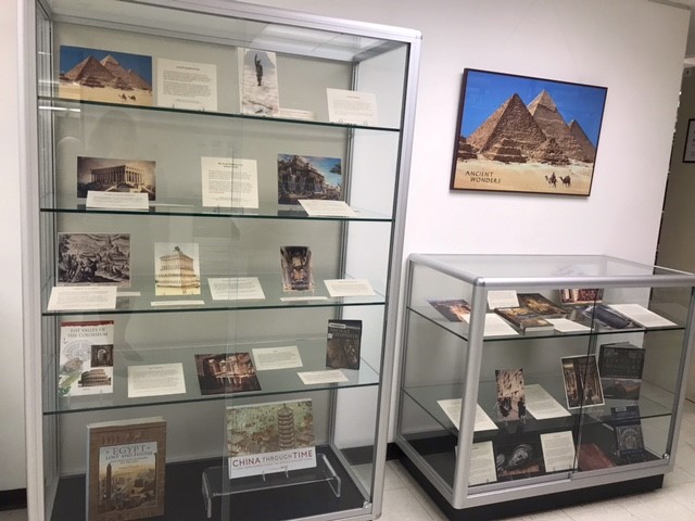 display case holding books and images