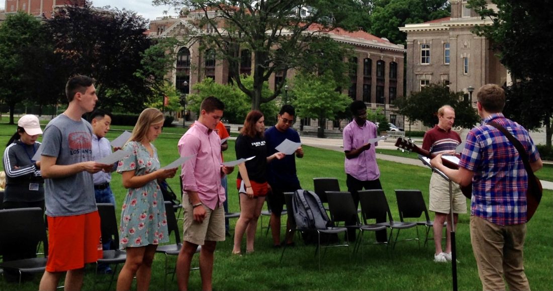 Students standing outside and fellowshipping.