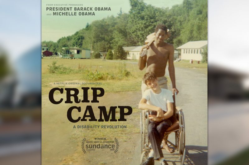 Crip Camp poster, featuring a young Black man pushing a young white man in a wheelchair