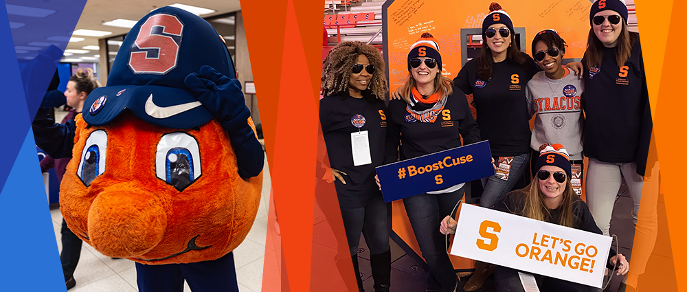 Syracuse University staff, along with Otto, holding signs supporting Boost the 'Cuse