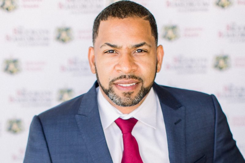 Mid Shot J.Christopher Hamilton in Blue Suit and Tie