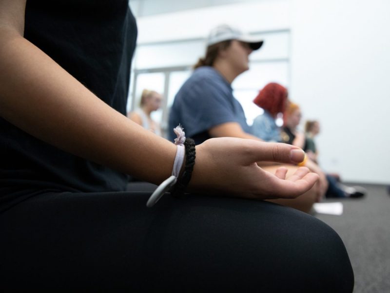 Line of people meditating