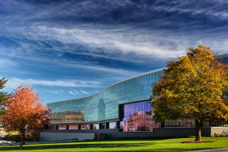 Exterior of the Newhouse School on a fall day