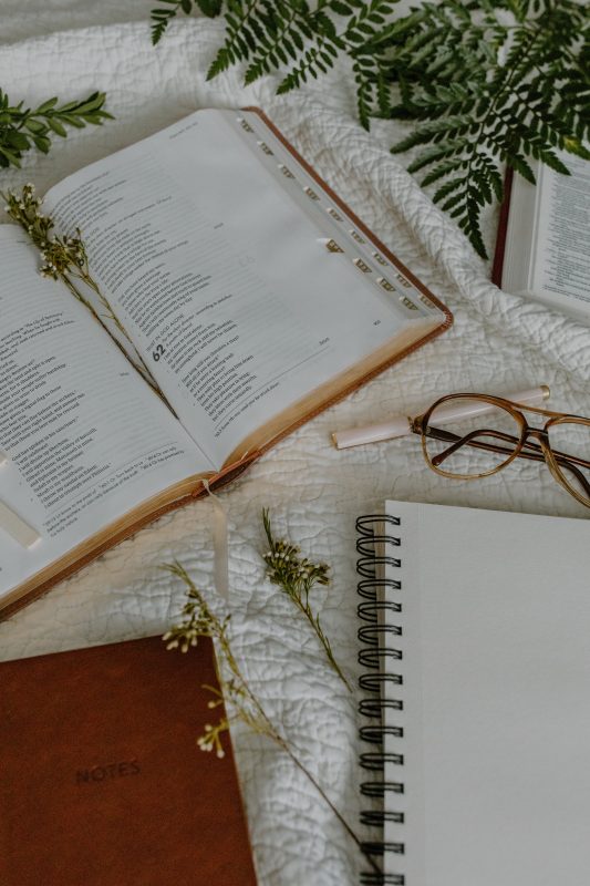 Book with flowers and glasses.