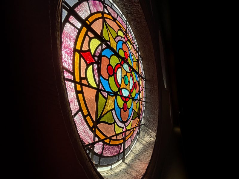 A stained glass window in Setnor Auditorium in Crouse College.