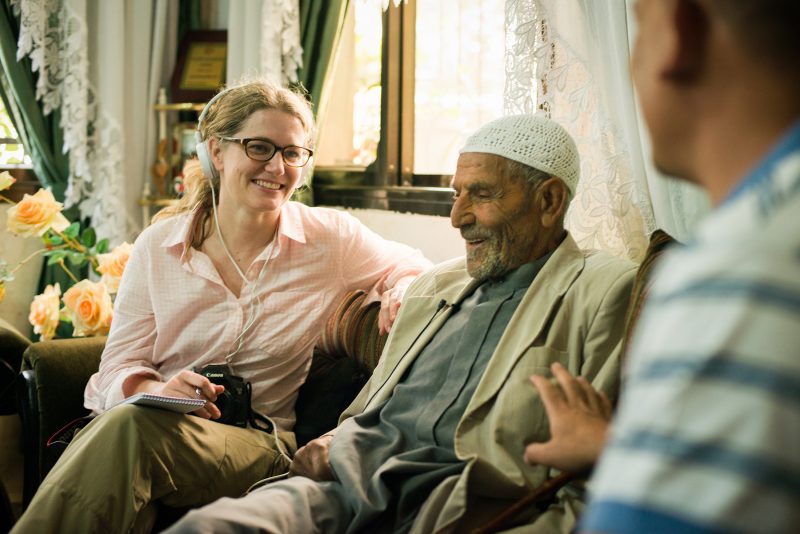 Newhouse student Jennifer Swanson interviews 100-year-old Mahmod Saad Sharaqa in Nablus, West Bank. Photo by Alexandra Hootnick.