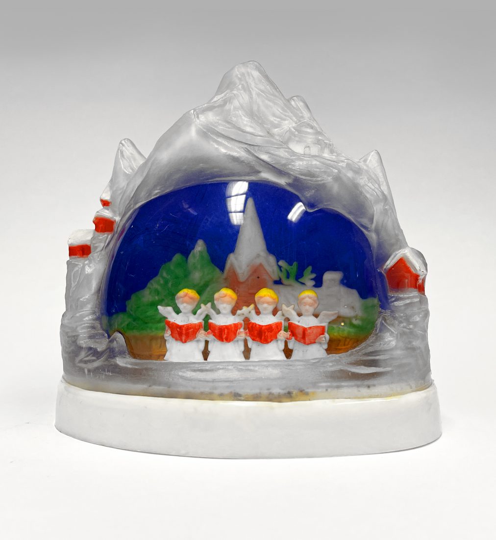 snow globe with mini people singing from hymnal