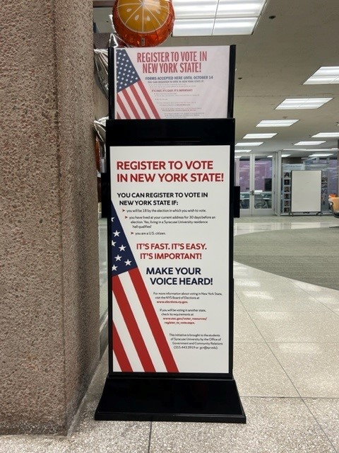 voter registration free standing kiosk with american flag on front